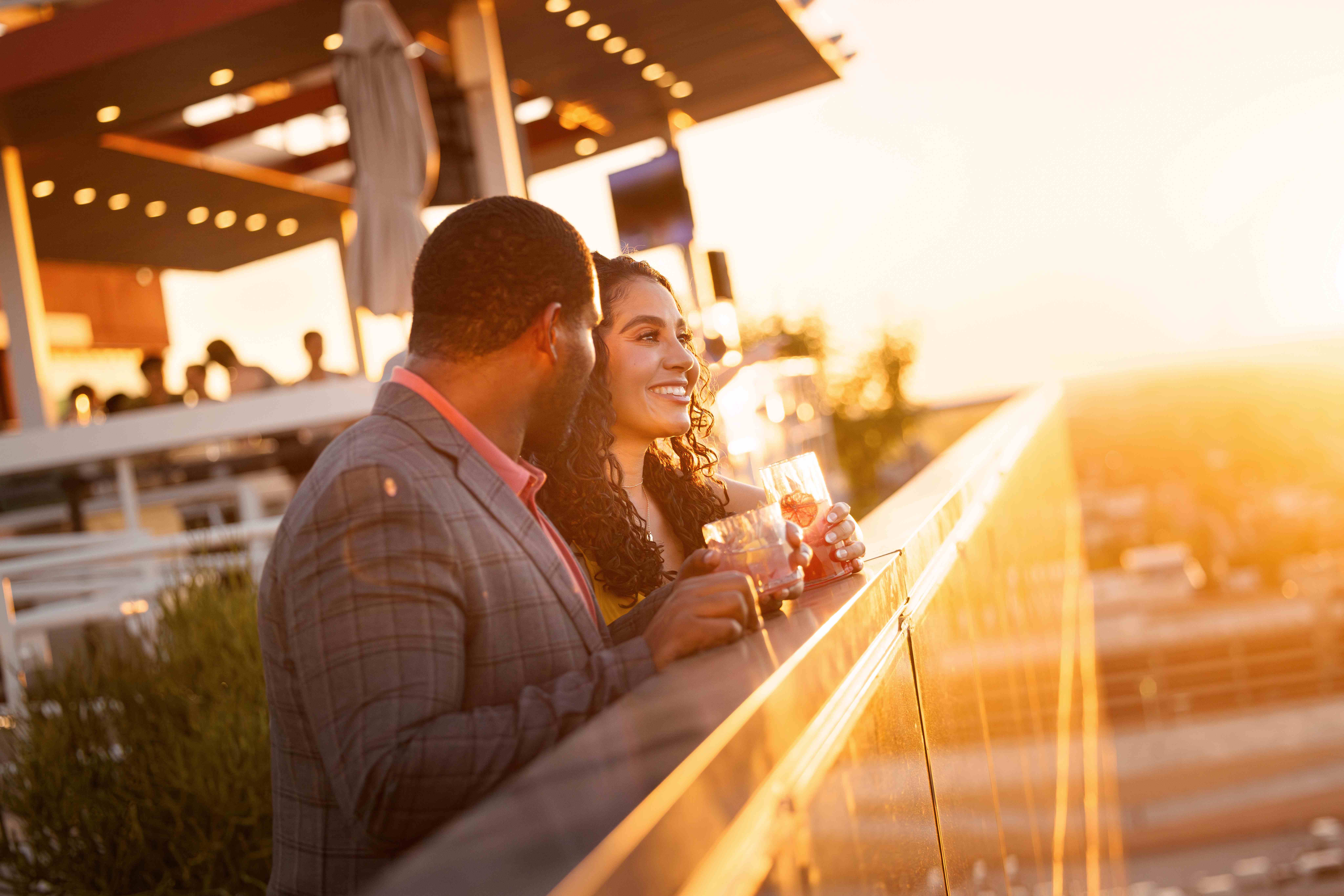 Couple enjoying sunset views at Skysill Rooftop Lounge in Tempe, Arizona Couple enjoying sunset views at Skysill Rooftop Lounge in Tempe, Arizona
